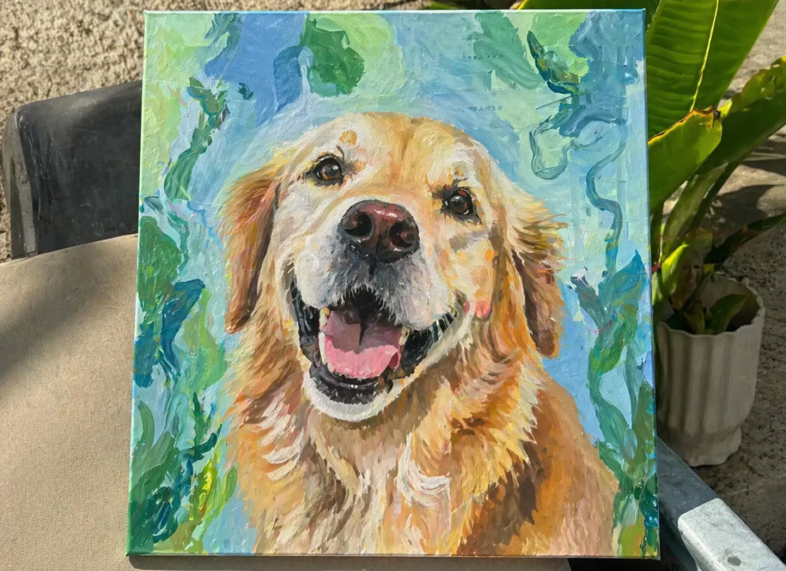 Painted oil portrait of a smiling golden retriever against a blue and green abstract background